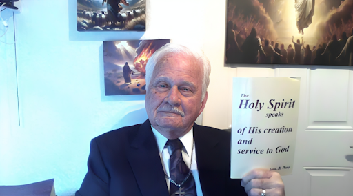 James A. Kemp holding a copy of The Holy Spirit Speaks